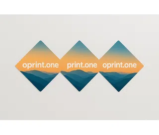 Diamond-shaped Easy Dot film stickers featuring a mountain landscape print in shades of blue and orange, and white text reading “oprint.one.”